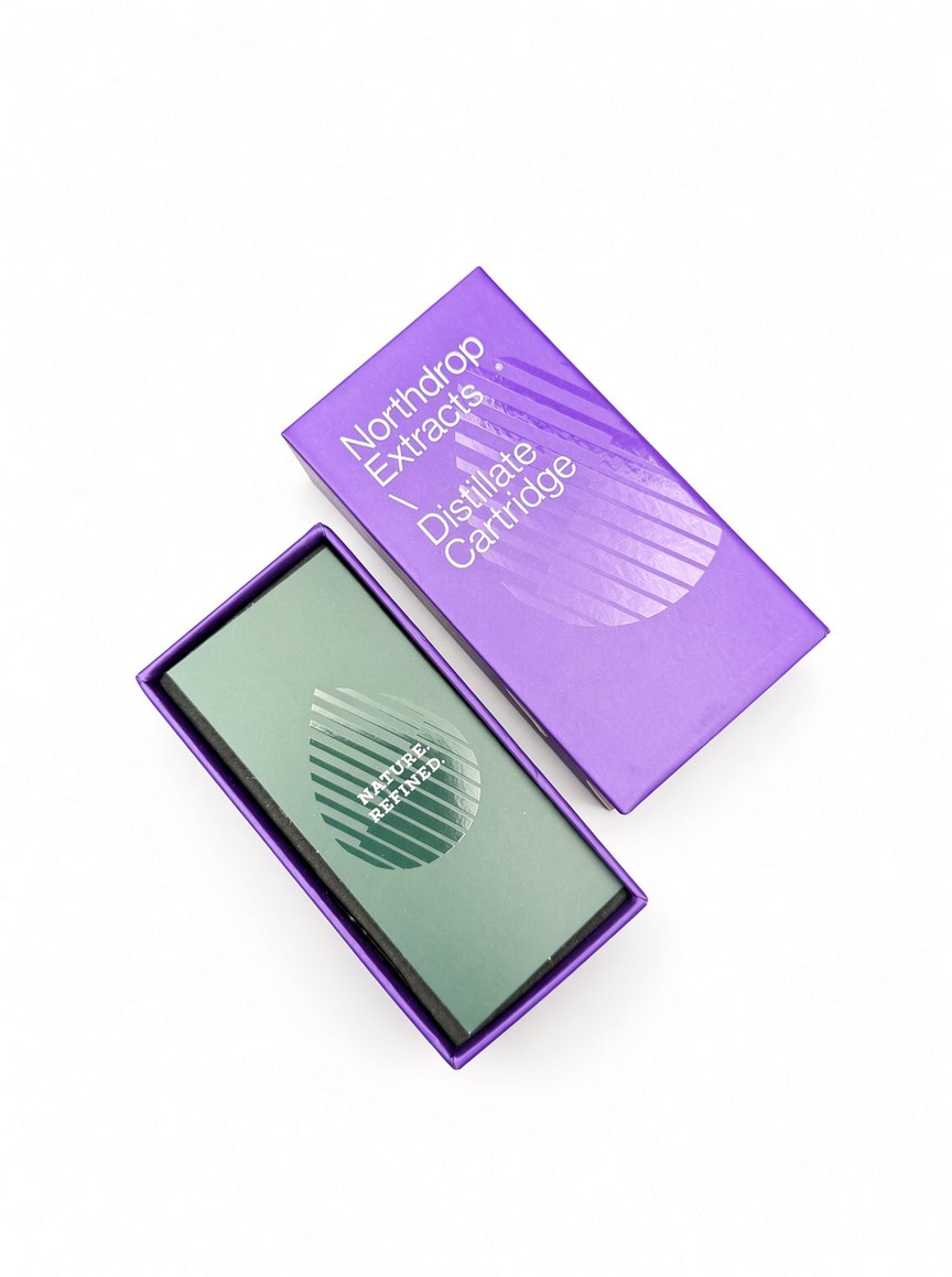 Opened Distillate Cartridge box with the green Nature. Refined. insert card in the tray